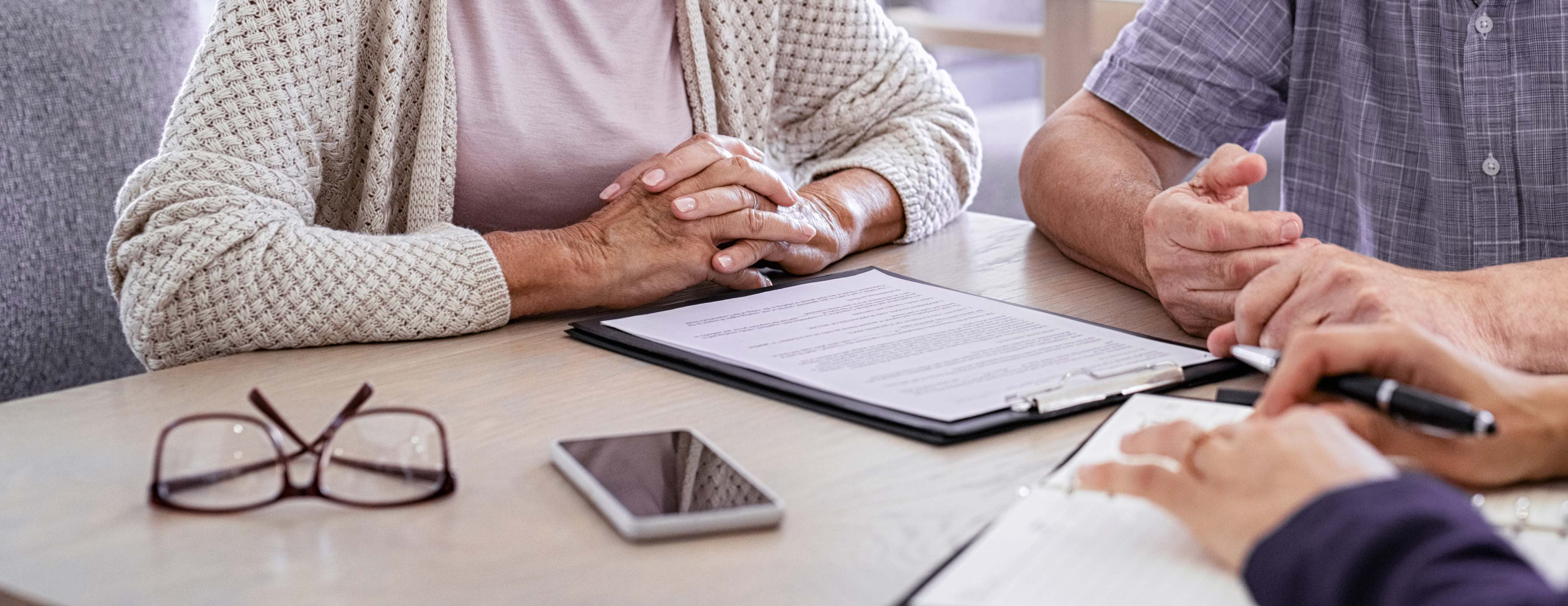 Clients hands with financial planner